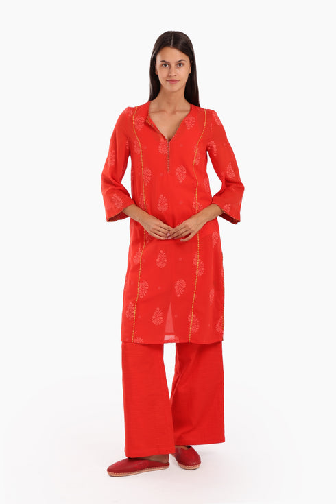 Embroidery tunic with contrast color piping in printed cotton voile